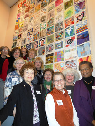 artists with peace quilt